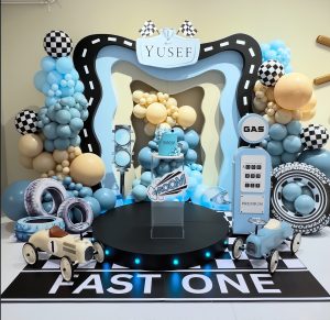 Fast One car birthday styling with race car themed props, custom backdrop and balloon garland by Colourful Treasures