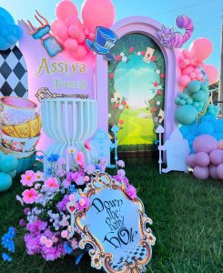 Wonderland / One-derland birthday styling with custom rabbit hole props, whimsical backdrops and decorative balloon garland by Colourful Treasures